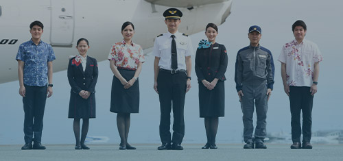 Staff lined up in front of aircraft